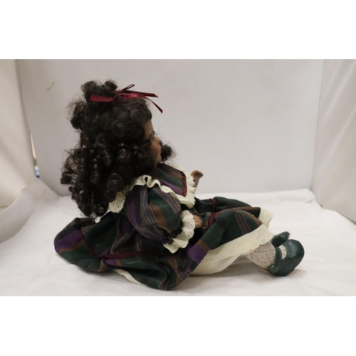 901 - A VINTAGE CHINA DOLL IN SEATED POSE