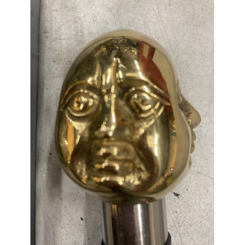 926 - A BRASS FOUR FACED BUDDHA HANDLE WALKING STICK