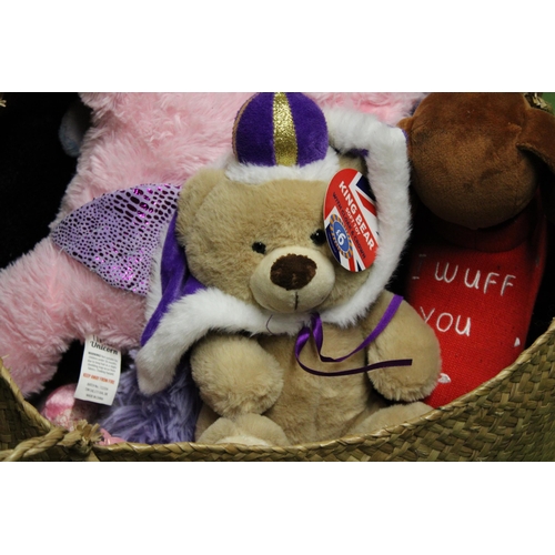 1165 - A BASKET CONTAINING A QUANTITY OF SOFT TOYS SOME WITH TAGS