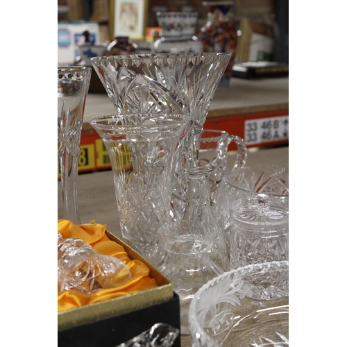 1235 - A QUANTITY OF HEAVY CUT GLASS TO INCLUDE VASES, BOWLS, JUGS, A PERFUME ATOMISER, BELL, ETC