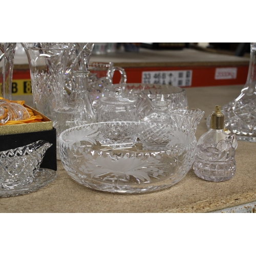 1235 - A QUANTITY OF HEAVY CUT GLASS TO INCLUDE VASES, BOWLS, JUGS, A PERFUME ATOMISER, BELL, ETC