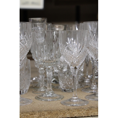 1265 - A QUANTITY OF CUT GLASS, GLASSES TO INCLUDE CHAMPAGNE FLUTES, WINE, BRANDY, SHERRY, ETC