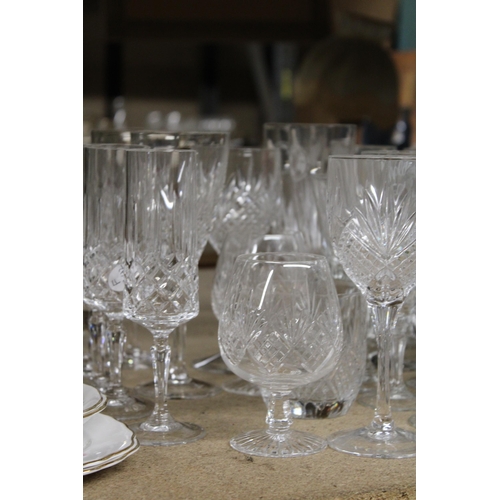 1265 - A QUANTITY OF CUT GLASS, GLASSES TO INCLUDE CHAMPAGNE FLUTES, WINE, BRANDY, SHERRY, ETC