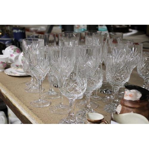 1265 - A QUANTITY OF CUT GLASS, GLASSES TO INCLUDE CHAMPAGNE FLUTES, WINE, BRANDY, SHERRY, ETC