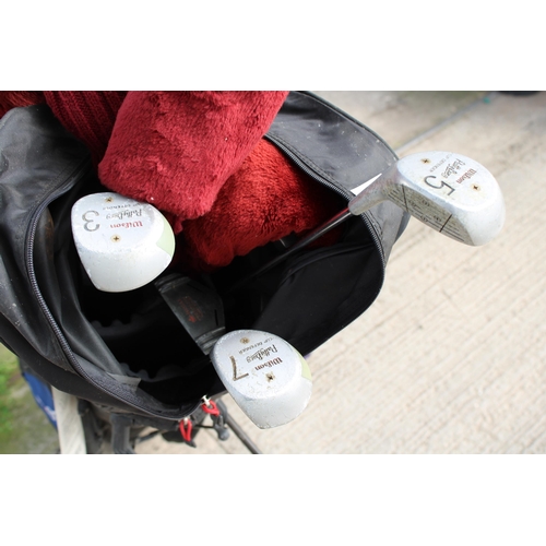 1649 - A PIVOT GOLF BAG AND AN ASSORTMENT OF GOLF CLUBS