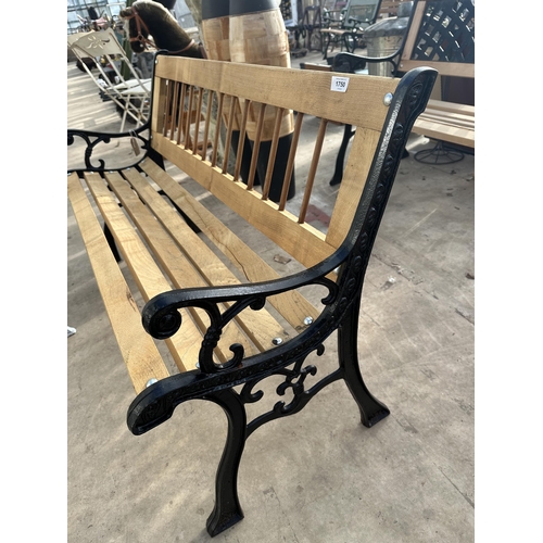 1750 - A WOODEN SLATTED GARDEN BENCH WITH CAST BENCH ENDS