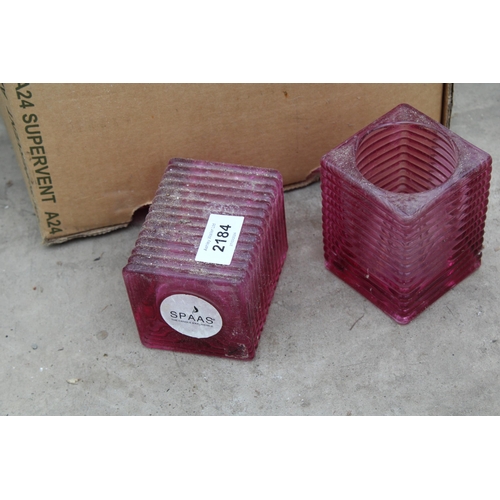 2184 - SEVENTEEN RED GLASS CANDLE HOLDERS