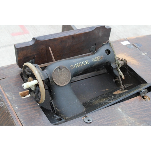 2213 - A VINTAGE SINGER SEWING MACHINE WITH WOODEN WORK TABLE