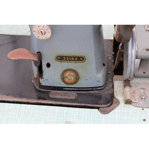 2371 - A VINTAGE SINGER INDUSTRIAL SEWING MACHINE WITH TREADLE BASE