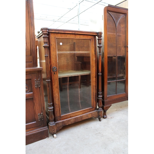 2556 - A VICTORIAN WALNUT MUSIC CABINET WITH GLASS DOOR, TURNED UPRIGHTS AND GALLERY BACK 23