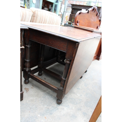 2654 - AN EARLY 20TH CENTURY OAK GATELEG DINING TABLE ON TURNED LEGS 72