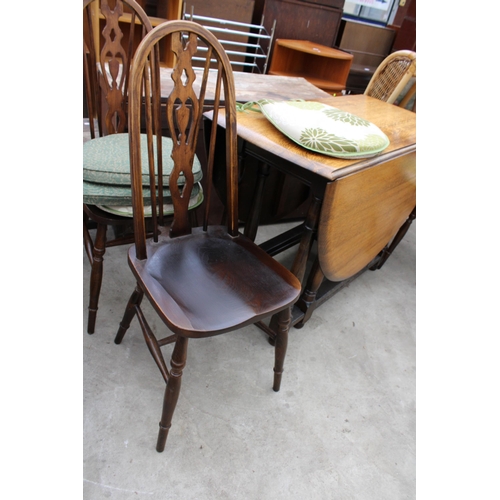 2669 - AN OVAL OAK GATELEG DINING TABLE AND FOUR ERCOL STYLE WINDSOR CHAIRS