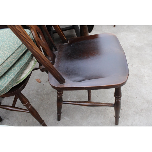 2669 - AN OVAL OAK GATELEG DINING TABLE AND FOUR ERCOL STYLE WINDSOR CHAIRS