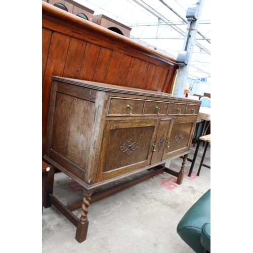 2703 - AN EARLY TWENTIETH CENTURY OAK SIDEBOARD ON BARLEY TWIST FRONT LEGS, 54