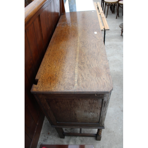 2703 - AN EARLY TWENTIETH CENTURY OAK SIDEBOARD ON BARLEY TWIST FRONT LEGS, 54