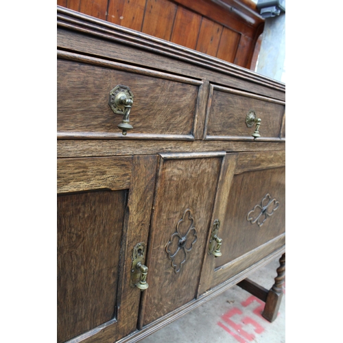 2703 - AN EARLY TWENTIETH CENTURY OAK SIDEBOARD ON BARLEY TWIST FRONT LEGS, 54