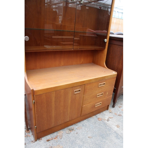 2799 - A RETRO TEAK UNIT WITH SMOKED GLASS DOORS, CUPBOARD AND DRAWERS TO BASE. 39.5