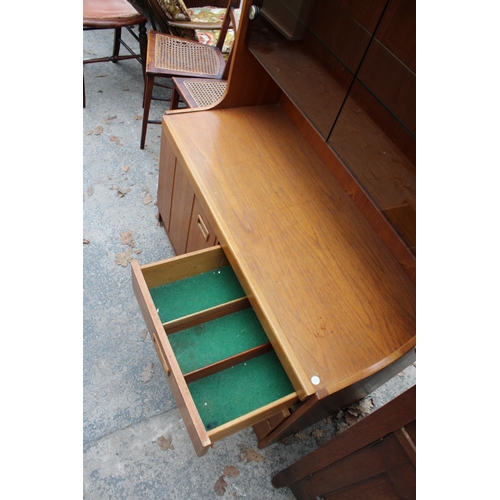 2799 - A RETRO TEAK UNIT WITH SMOKED GLASS DOORS, CUPBOARD AND DRAWERS TO BASE. 39.5