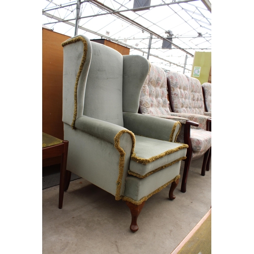 2914 - A SHACKLETONS FURNITURE WINGED FIRESIDE CHAIR ON FRONT CABRIOLE LEGS