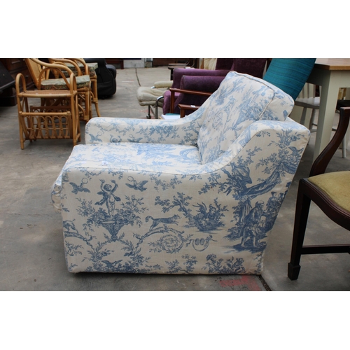 2994 - A LOW EASY CHAIR WITH FLORAL COVER