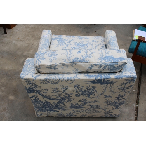 2994 - A LOW EASY CHAIR WITH FLORAL COVER