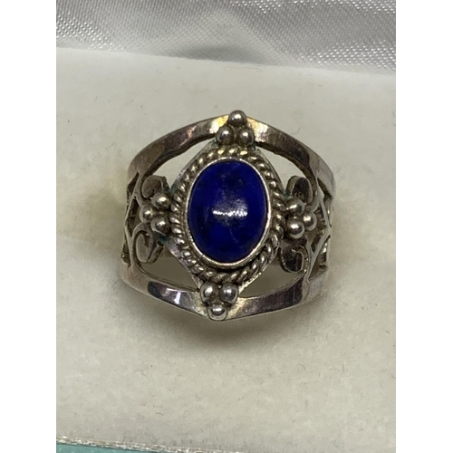 530 - A BOXED SILVER PURPLE STONE RING