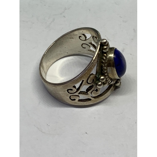 530 - A BOXED SILVER PURPLE STONE RING