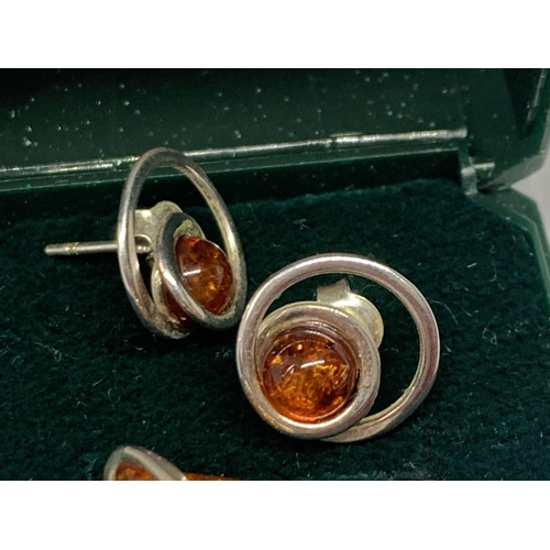 559 - TWO PAIRS OF SILVER AND AMBER EARRINGS IN A PRESENTATION BOX