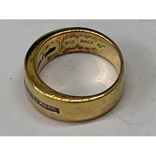 563 - A SILVER GILT AND STONE RING IN A PRESENTATION BOX