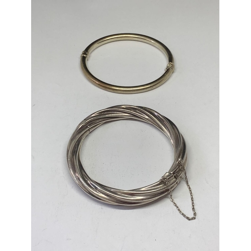 586 - TWO SILVER BANGLES