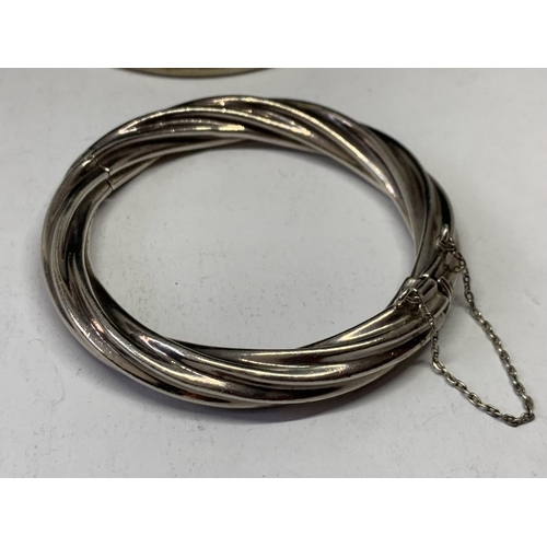 586 - TWO SILVER BANGLES