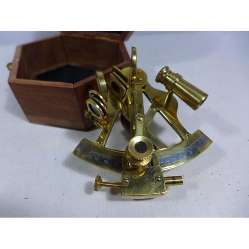 437 - A CASED SMALL BRASS SEXTANT