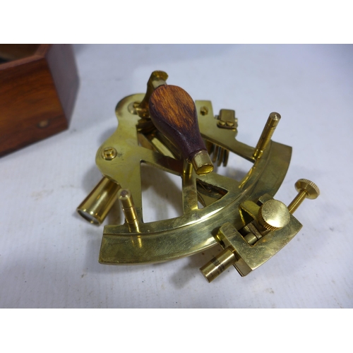 437 - A CASED SMALL BRASS SEXTANT