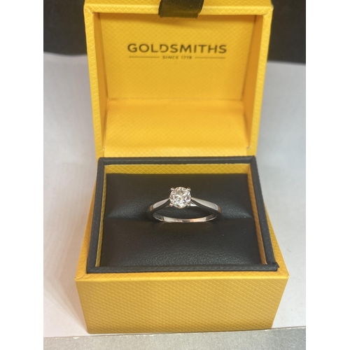 501 - AN 18 CARAT WHITE GOLD RING WITH A 0.5 CARAT SOLITAIRE DIAMOND COMPLETE WITH GGI CERTIFICATE IN ORIG... 