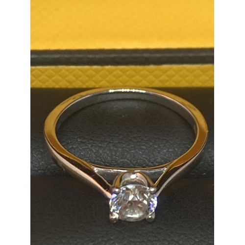 501 - AN 18 CARAT WHITE GOLD RING WITH A 0.5 CARAT SOLITAIRE DIAMOND COMPLETE WITH GGI CERTIFICATE IN ORIG... 