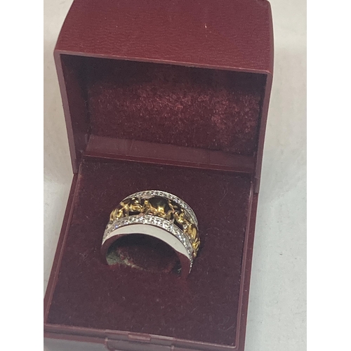 610 - A GOLD ON SILVER ELEPHANT RING IN A PRESENTATION BOX