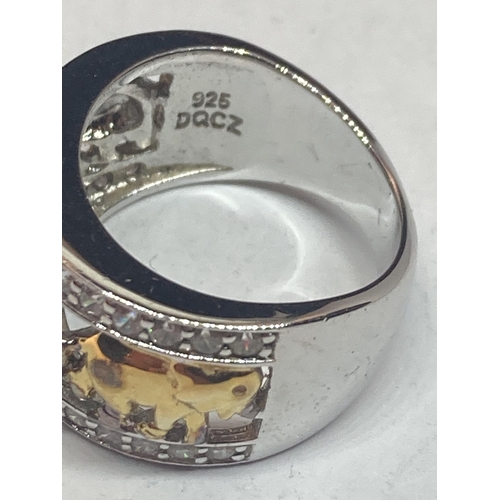 610 - A GOLD ON SILVER ELEPHANT RING IN A PRESENTATION BOX