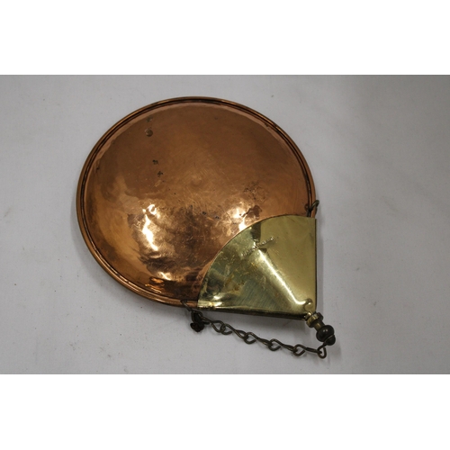 114 - A VINTAGE COPPER POWDER FLASK WITH A COAT OF ARMS