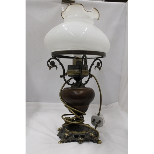 117 - A VINTAGE STYLE TABLE LAMP IN THE STYLE OF AN OIL LAMP, WITH FLUTED GLASS SHADE, WOODEN MIDDLE AND M... 