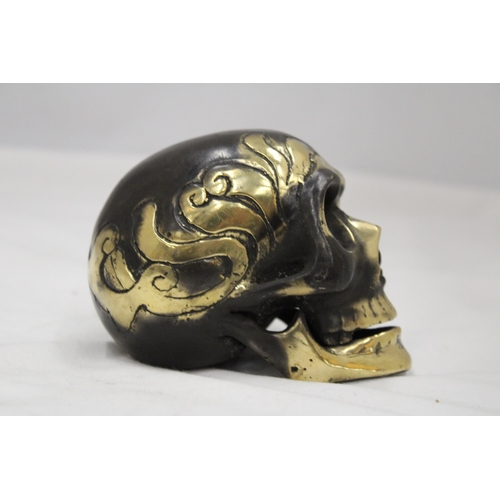 124 - A BRONZE SKULL