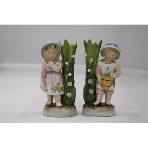 141 - TWO VINTAGE GERMAN CONTA AND BOHME FAIRINGS TO INCLUDE A GIRL WITH JUG VASE AND A GIRL WITH BASKET V... 