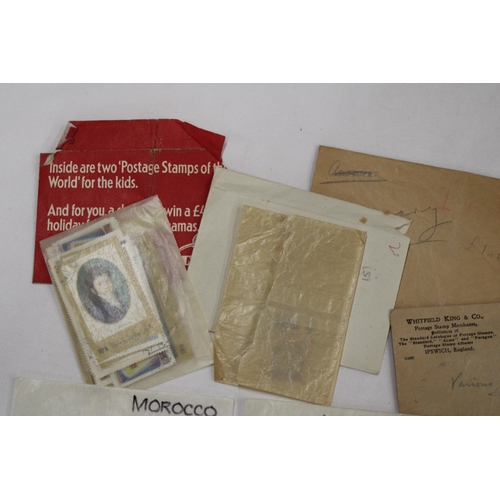 441 - A QUANTITY OF LOOSE STAMPS IN PACKETS FROM AROUND THE WORLD