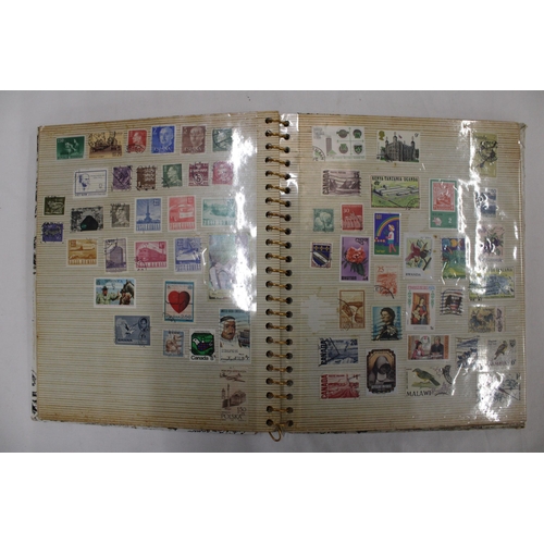 452 - THREE ALBUMS CONTAINING STAMPS OF THE WORLD