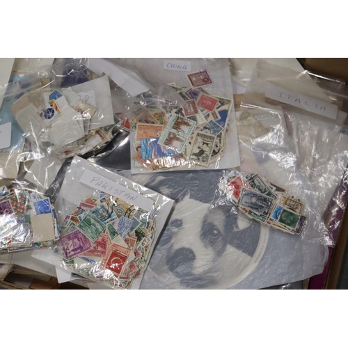 385 - A LARGE QUANTITY OF USED STAMPS ON ENVELOPES AND STAMPS TO INCLUDE SPAIN, CANADA, MALTA, ETC.,