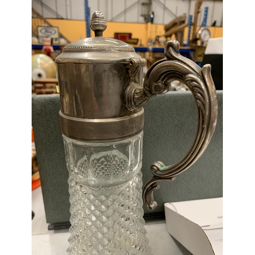 296 - A CUT GLASS CLARET JUG WITH SILVER PLATED TOP AND A SMALL PEWTER JUG