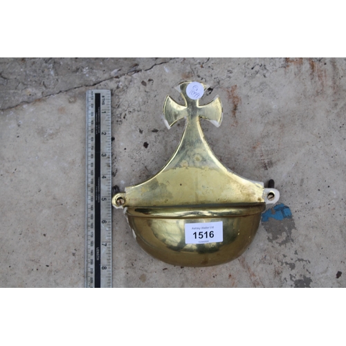 1516 - A VINTAGE BRASS WALL MOUNTED HOLY WATER CARRIER