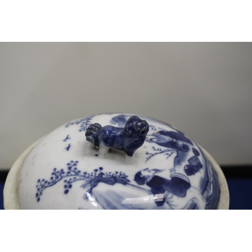 33 - AN ORIENTAL BLUE AND WHITE LIDDED POT WITH FOO DOG LID