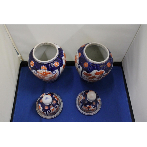 35 - A PAIR OF IMARI LIDDED GINGER JARS