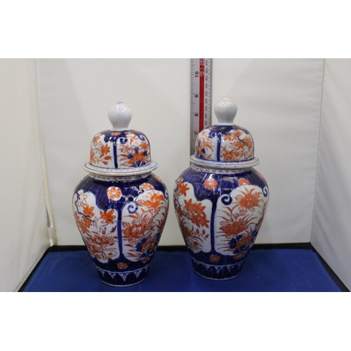 35 - A PAIR OF IMARI LIDDED GINGER JARS