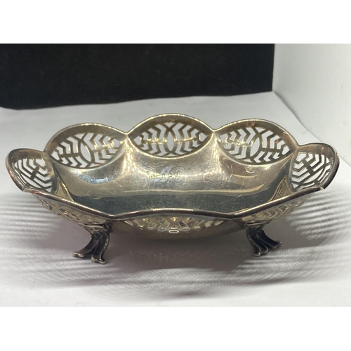 4 - A HALLMARKED BIRMINGHAM SILVER PIERCED DISH ON FOUR FEET GROSS WEIGHT 99.1 GRAMS